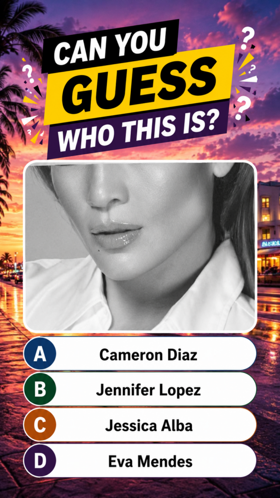A cropped black-and-white portrait of Jennifer Lopez s lower face lips chin jawline against a vibrant sunset streetscape