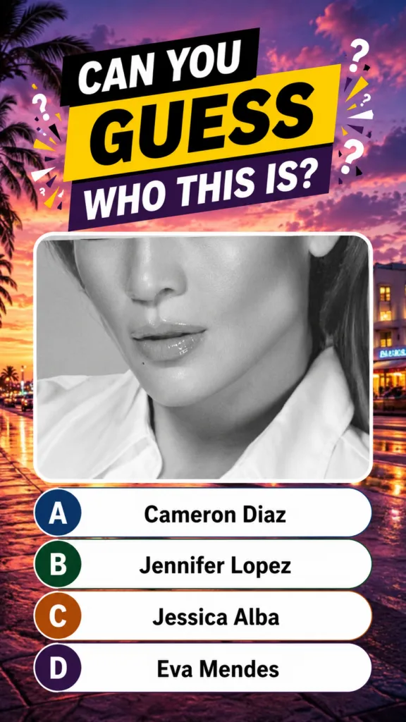 A cropped black-and-white portrait of Jennifer Lopez s lower face lips chin jawline against a vibrant sunset streetscape