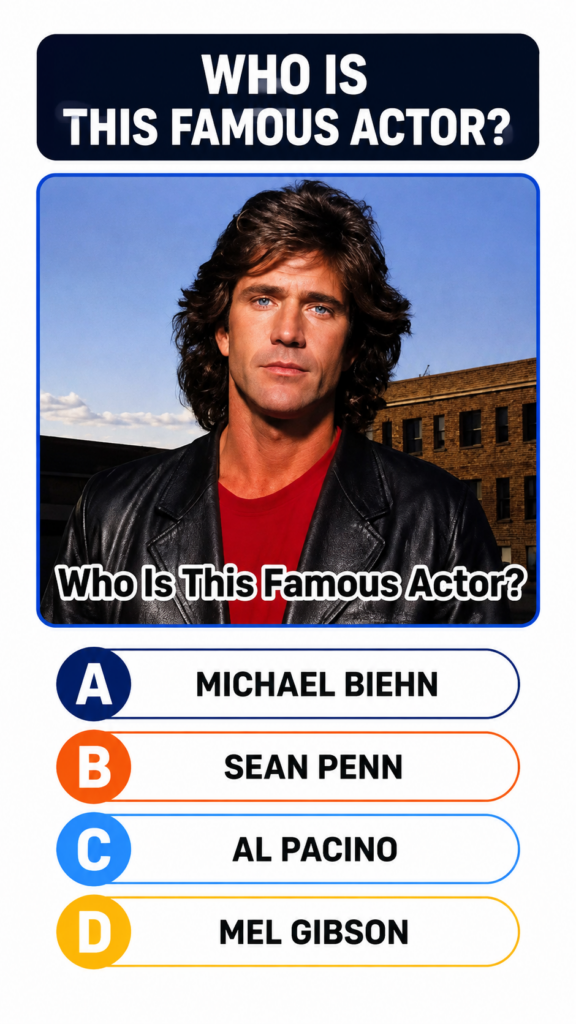 A vintage portrait of a young Mel Gibson with voluminous dark wavy hair striking blue eyes a red t-shirt and a black lea
