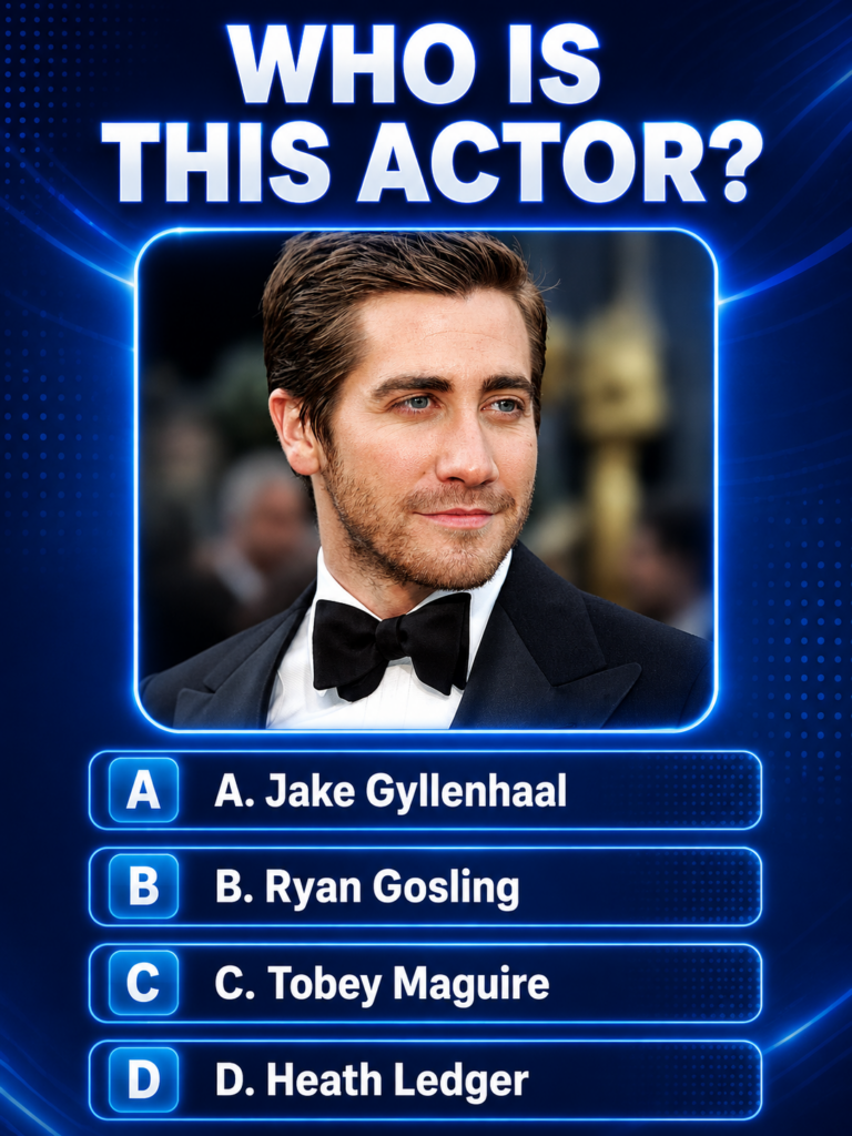 A headshot of actor Jake Gyllenhaal in a black tuxedo looking slightly to the right with a serene expression with promin