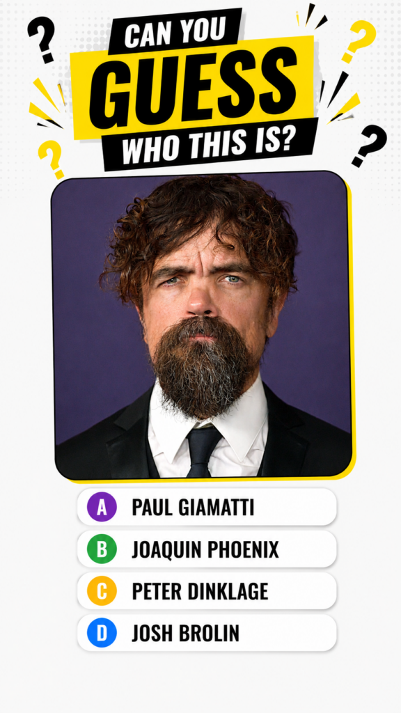Portrait of actor Peter Dinklage with curly brown hair and beard wearing a suit against a purple background as seen in t