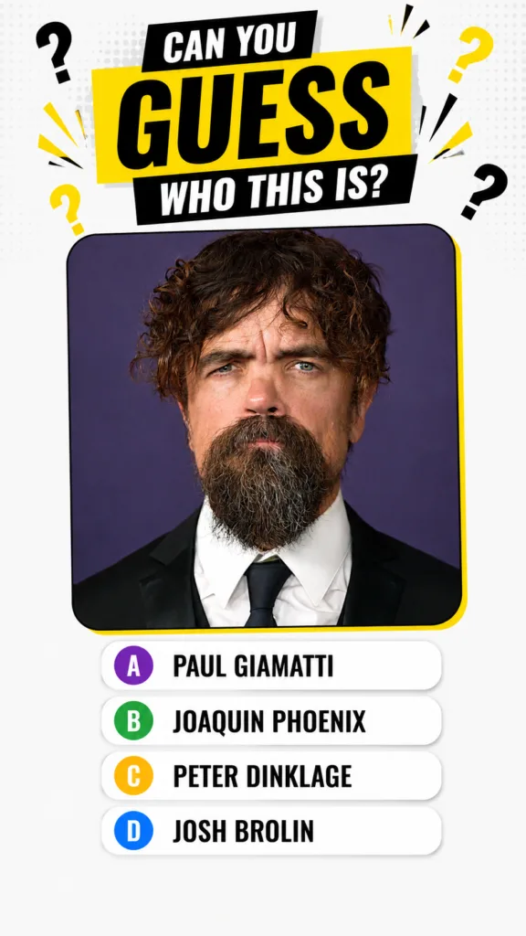 Portrait of actor Peter Dinklage with curly brown hair and beard wearing a suit against a purple background as seen in t