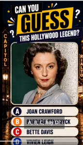 A color portrait of actress Barbara Stanwyck with neatly coiffed brown hair red lipstick and a triple-strand pearl neckl