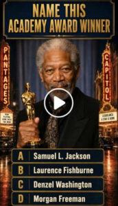 Morgan Freeman smiling gently holding a golden Oscar statue in a dark suit and patterned tie The background is a richly 