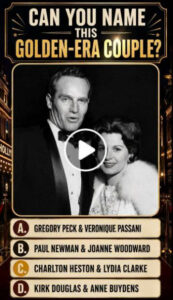 A black and white portrait of Charlton Heston in a tuxedo and Lydia Clarke in an elegant dress with a fur stole looking 