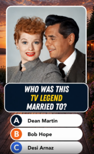 A colorized classic portrait of Lucille Ball and Desi Arnaz Lucille Ball has red hair and red lipstick wearing a houndst