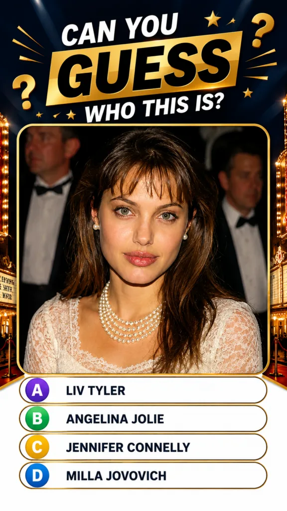 A young Angelina Jolie as seen in the quiz with bangs wearing a white lace dress and pearls