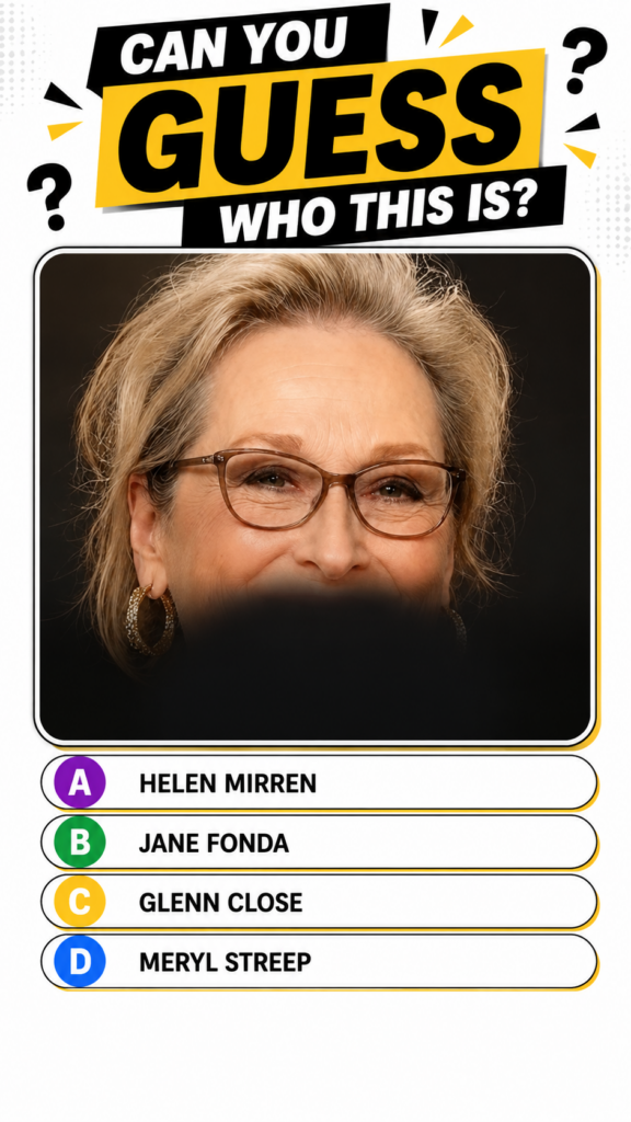 Meryl Streep smiling subtly wearing brown-framed glasses and gold hoop earrings with blonde hair framing her face Her mo