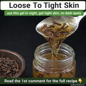 A close-up of fresh cloves in a small bowl with a hint of water nearby suggesting preparation for an infusion