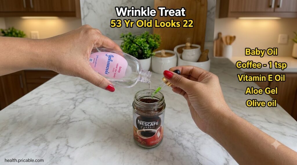 Hands pouring baby oil and green essential oil into a jar with coffee grounds to make a DIY wrinkle treat oil