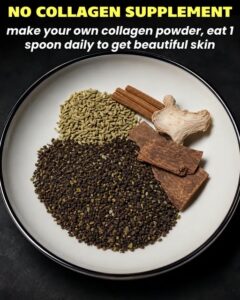 A close-up shot of a small bowl containing a light brown or yellowish fine powder with a wooden spoon scooping some Ingr