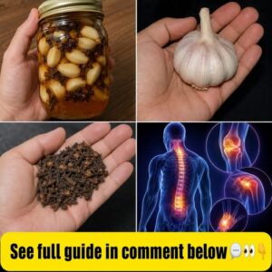 A close-up of a rustic wooden bowl filled with fresh garlic cloves and whole dried cloves beside a glass of amber-colore
