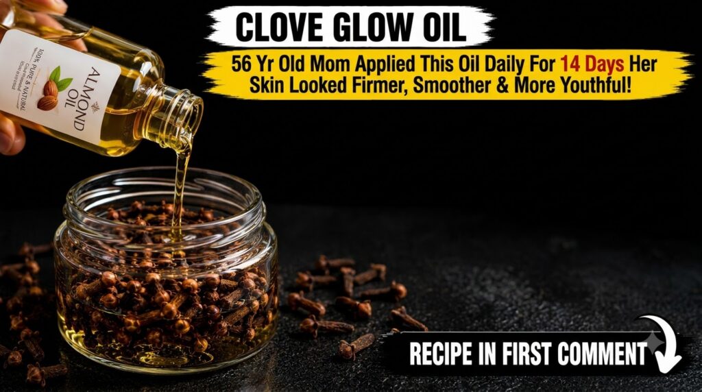 A hand pouring golden almond oil from a clear bottle into a glass jar filled with dark brown cloves emphasizing the prep