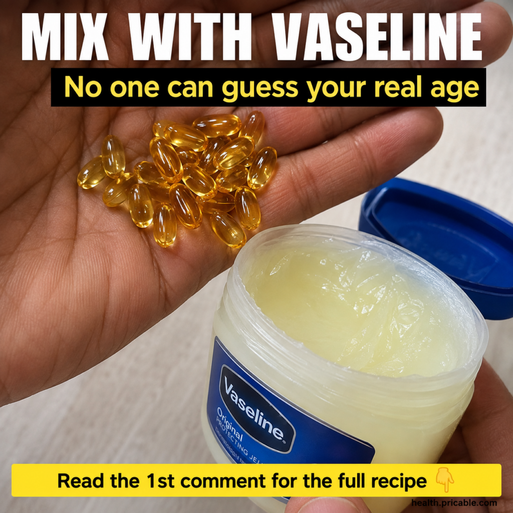 A hand holding vitamin E capsules next to an open jar of Vaseline Original Protecting Jelly suggesting a mixture