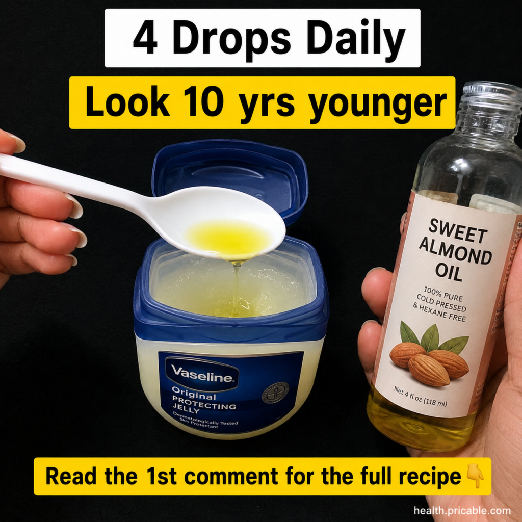 A close-up shot of a hand adding sweet almond oil from a spoon into a tub of Vaseline Original Protecting Jelly The back