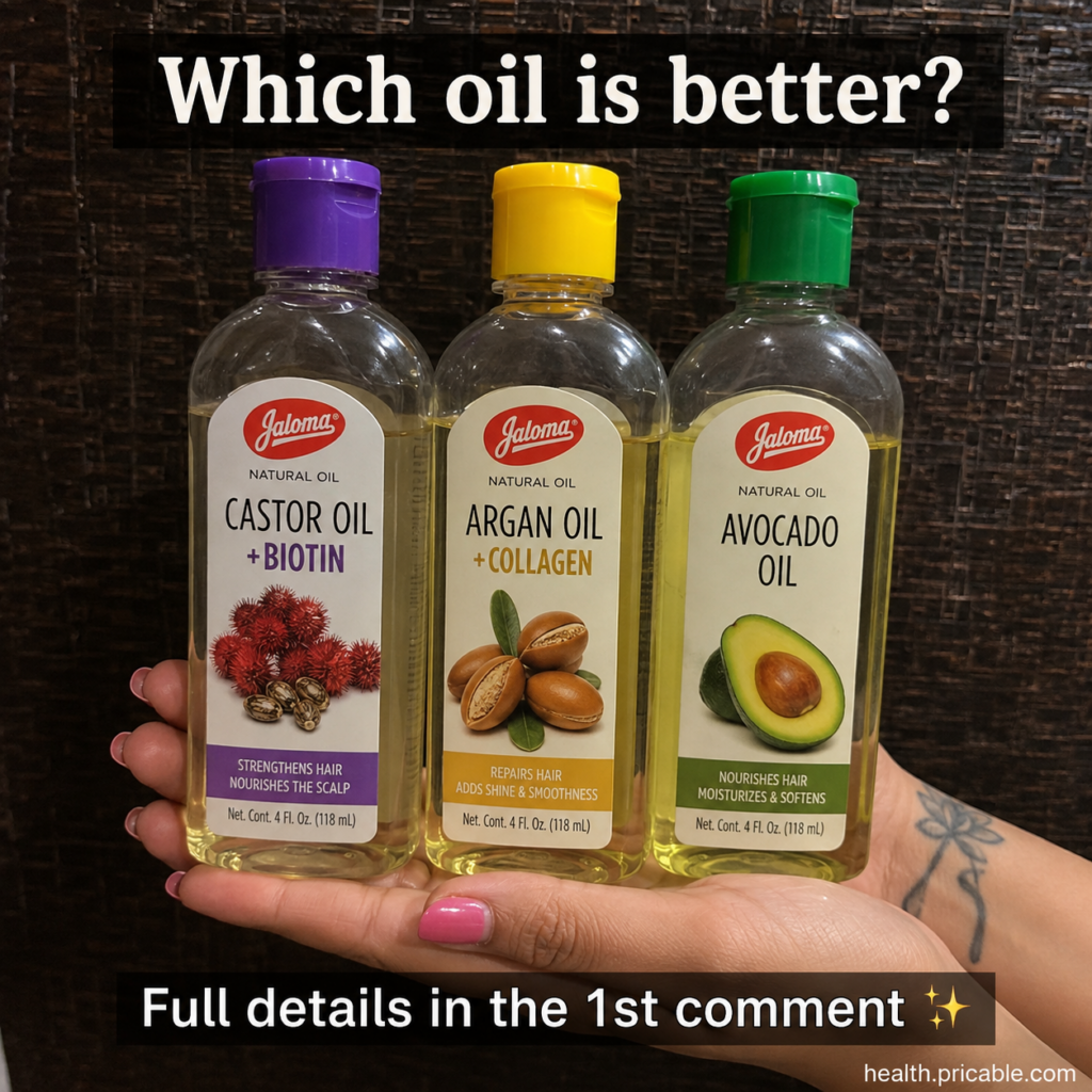 Three clear plastic bottles of natural oils Castor Argan Avocado held by a person s hand The bottles have distinct color