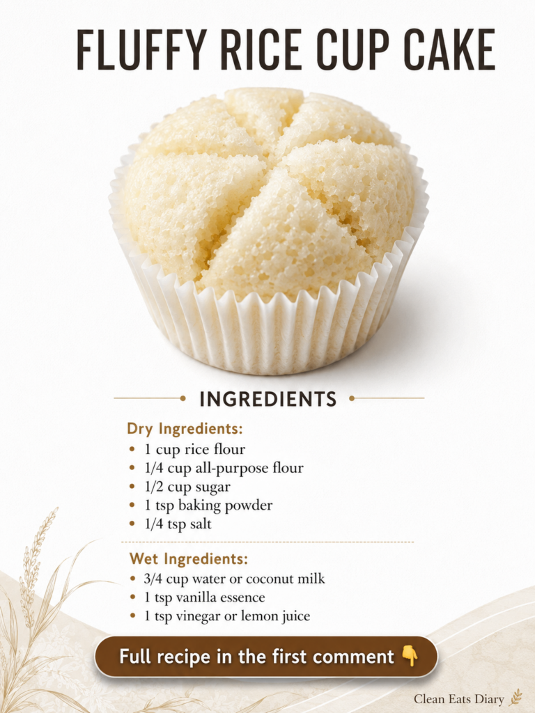 A single fluffy rice cupcake in a white paper liner showcasing its light airy texture and subtle surface cracks against 
