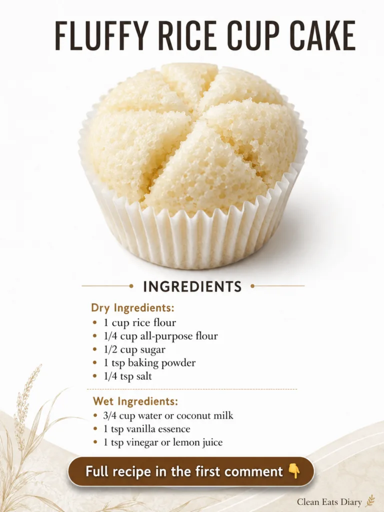 A single fluffy rice cupcake in a white paper liner showcasing its light airy texture and subtle surface cracks against 