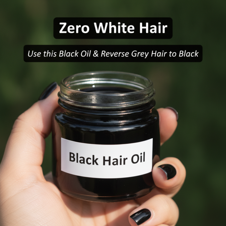 A close-up of a hand holding a small dark glass jar labeled Black Hair Oil with blurred green foliage in the background 