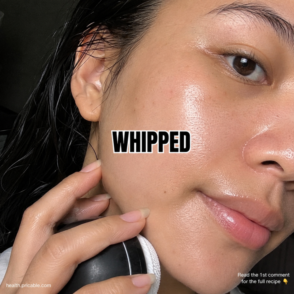 A person with dewy glass skin texture showing a hydrated and reflective complexion A hand gently holds a skincare cleans