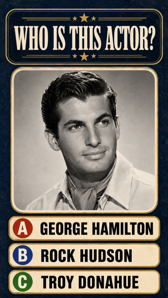 A sepia-toned black and white portrait of a handsome young man with slicked-back hair typical of a classic studio headsh