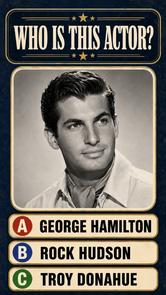 A sepia-toned black and white portrait of a handsome young man with slicked-back hair typical of a classic studio headsh
