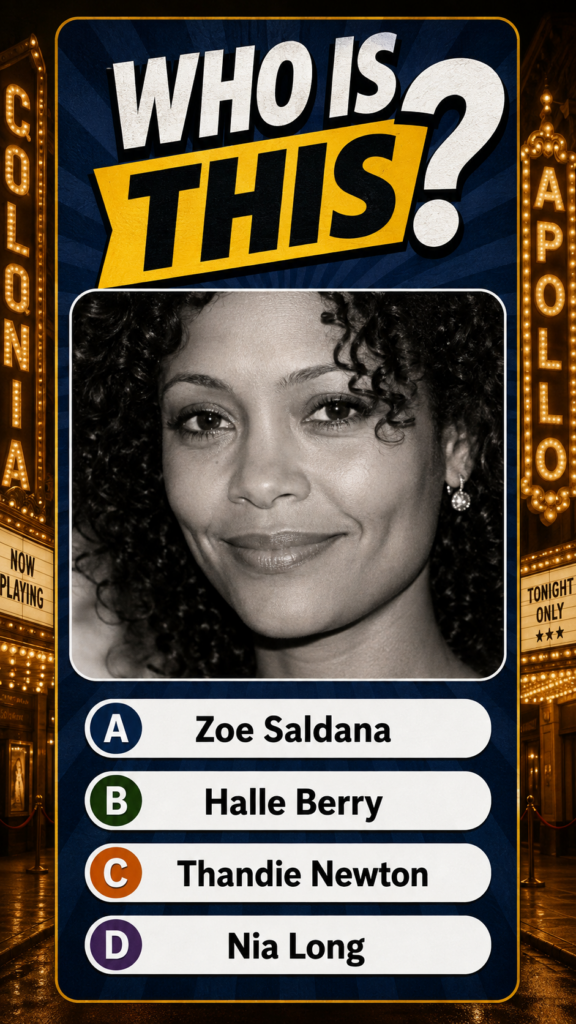 Black and white portrait of a woman with curly hair and a dimpled smile against a theatrical background with marquee sig