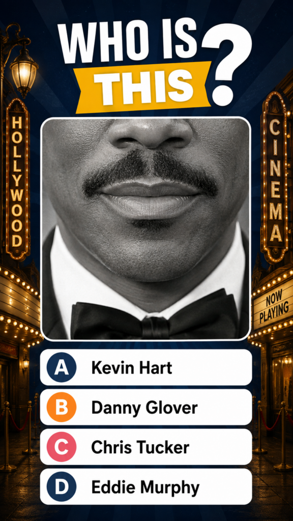 A black and white close-up portrait of a male celebrity s lower face mustache mouth chin wearing a bow tie set against a