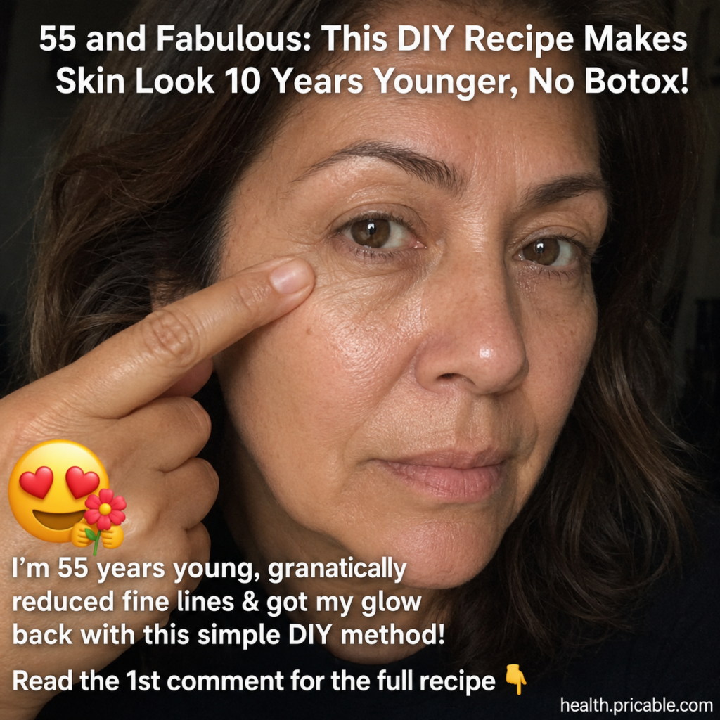 A woman in her 50s gently applying a creamy face mask to her cheek smiling softly Her skin looks fresh and radiant She i