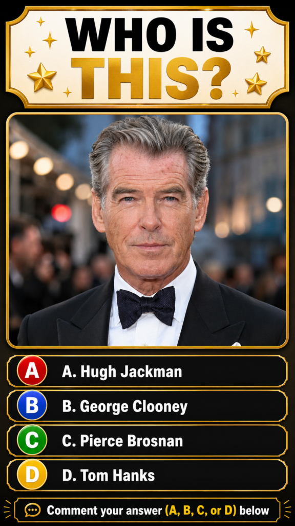 A headshot of actor Pierce Brosnan wearing a classic black tuxedo with a black bow tie and white shirt looking directly 