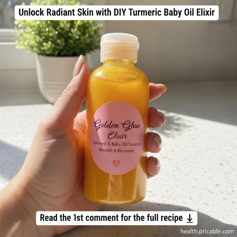 A hand holding a small clear plastic bottle filled with a vibrant yellow turmeric and baby oil elixir The bottle has a p