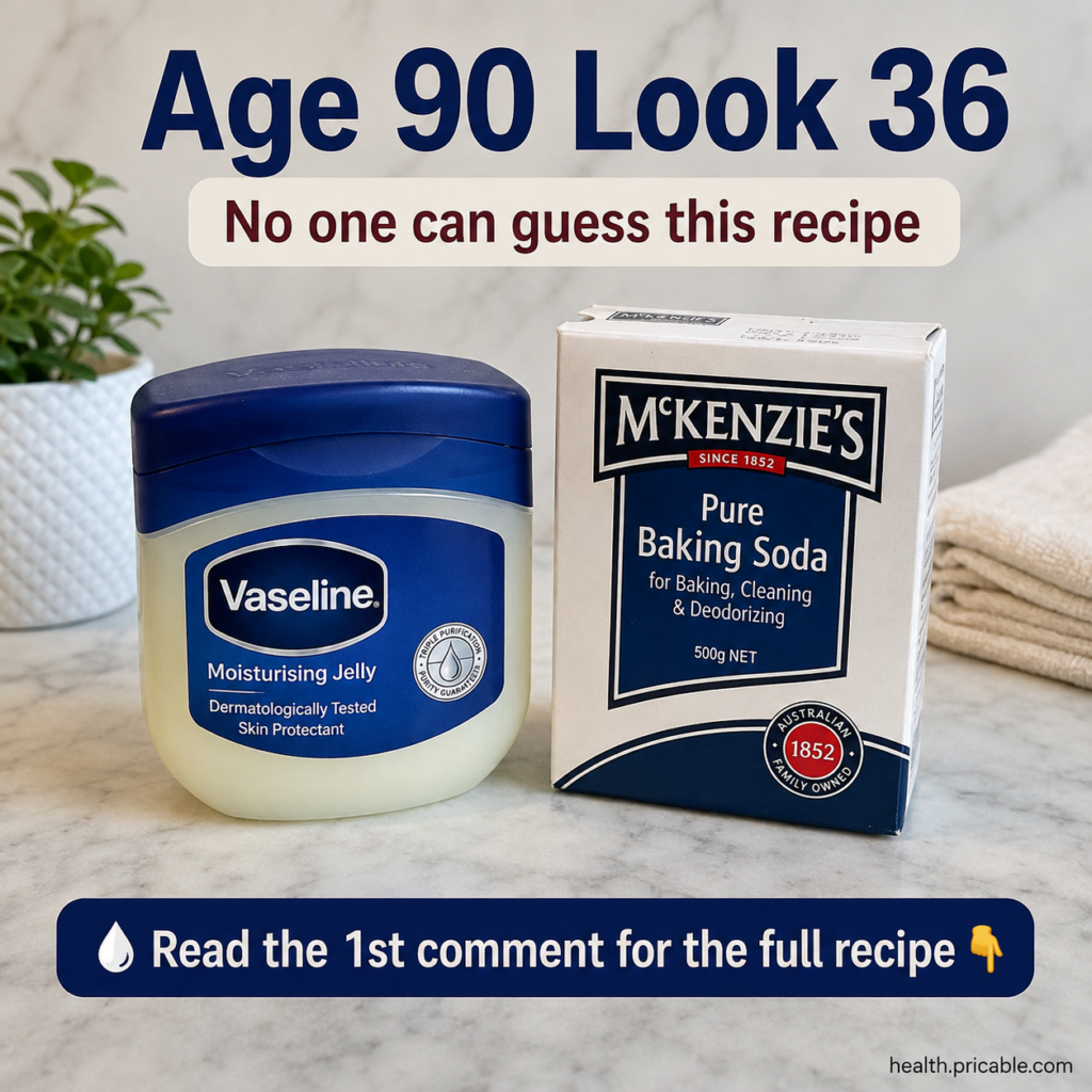A small bowl of baking soda and a jar of honey on a light marble countertop with a small green plant in the background r