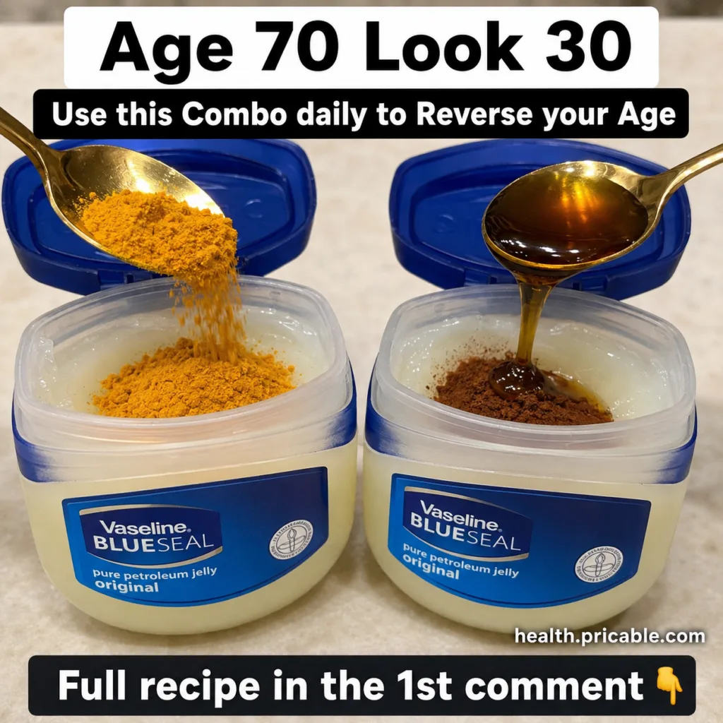 A small glass jar with a creamy yellowish-orange face mask made of Vaseline turmeric and honey with a small spoon beside
