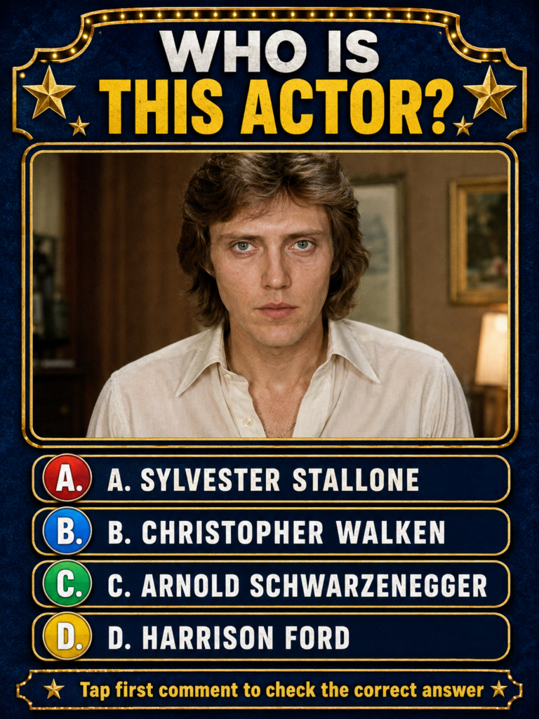 A headshot of a young Christopher Walken with distinctive green eyes a serious expression and longish brown hair wearing