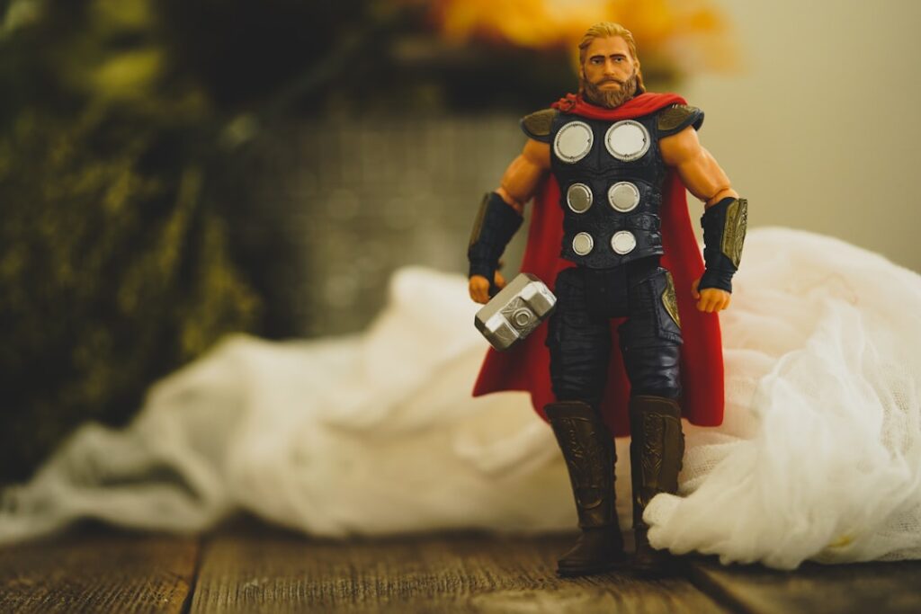 Chris Hemsworth as Thor wielding Mjolnir in an action pose from a Marvel movie