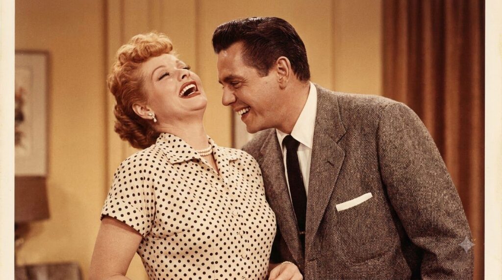 A classic authentic photo of Lucille Ball and Desi Arnaz together looking happy and iconic from the I Love Lucy era