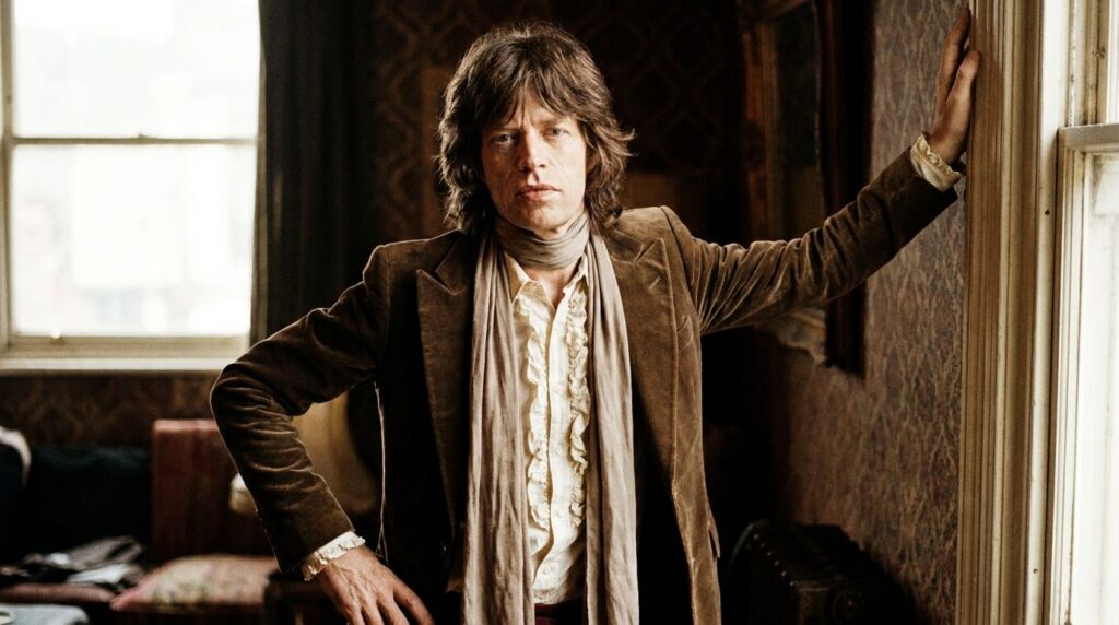 A real publicity photo of Mick Jagger in the 1970s showcasing his distinctive fashion style