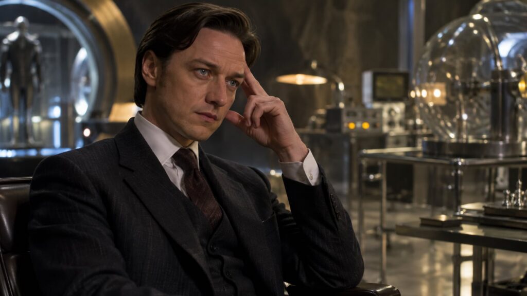 James McAvoy as Professor X in X-Men First Class looking thoughtful in a suit perhaps in a period setting with other cha