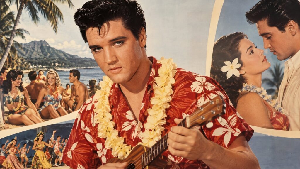A real movie poster for one of Elvis Presley s iconic films such as Jailhouse Rock or Blue Hawaii featuring him prominen