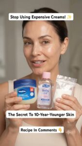 A woman applying a clear homemade gel to her face as part of her night routine with a subtle glow on her skin