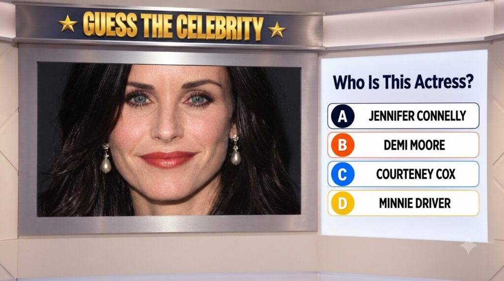 A cropped close-up of Courteney Cox s lower face showing her mouth chin neck and dark hair with pearl drop earrings It s