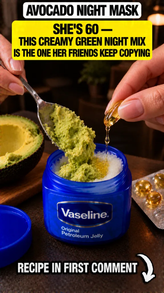 Hands preparing a homemade beauty mask with avocado Vaseline and vitamin E shown in a close-up overhead view Mashed avoc