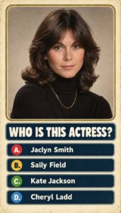 A headshot of a young Jaclyn Smith perhaps from the late 1970s or early 1980s with her signature hairstyle and a classic