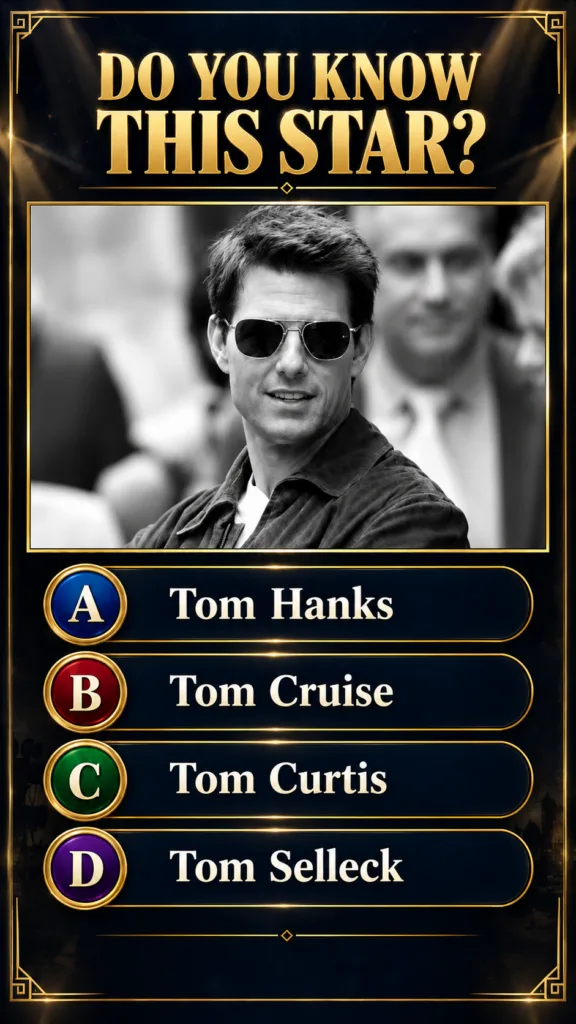 Black and white portrait of a young Tom Cruise wearing sunglasses and a casual jacket smiling faintly The image is frame