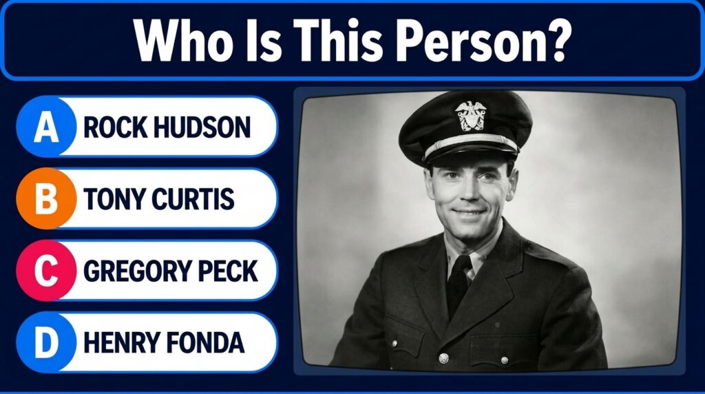 A black and white portrait of a smiling man in a military uniform wearing a cap with an emblem presented as a quiz image