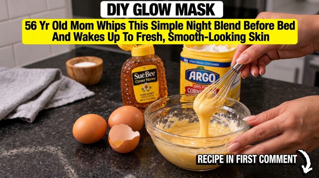 A close-up shot of ingredients for a DIY glow mask a hand whisking a yellow mixture in a glass bowl with a bottle of hon