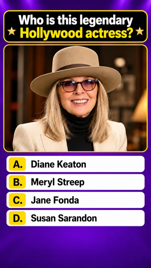 Portrait of Diane Keaton in a quiz poster smiling warmly and wearing a beige fedora hat dark-rimmed glasses a black turt