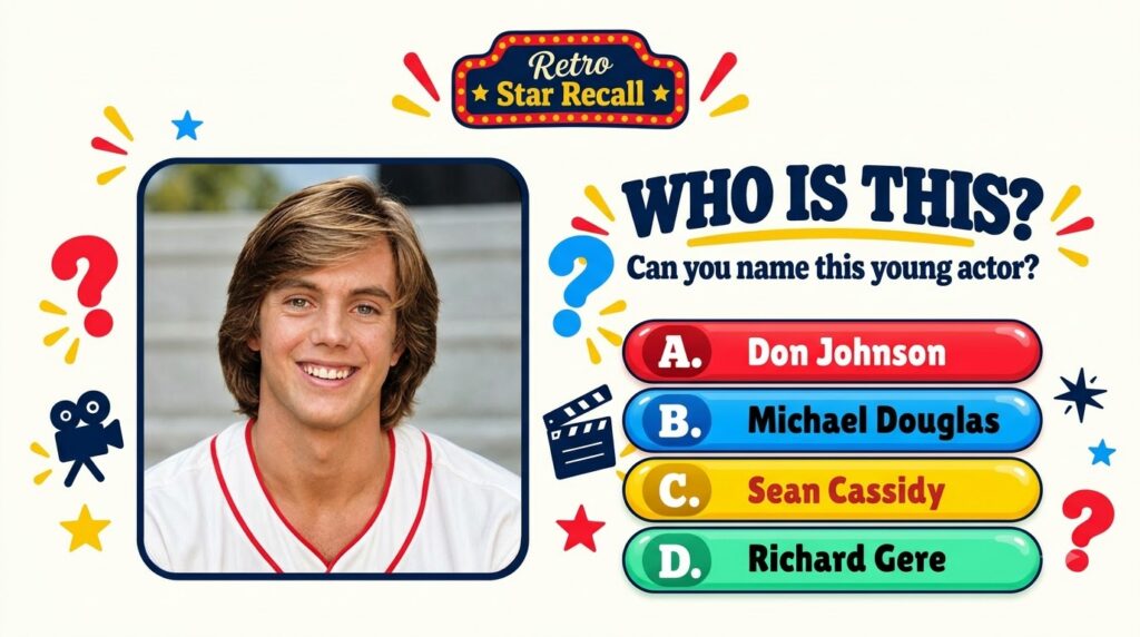 A smiling young Shaun Cassidy from his teen idol days with shoulder-length brown hair and a white baseball jersey with r