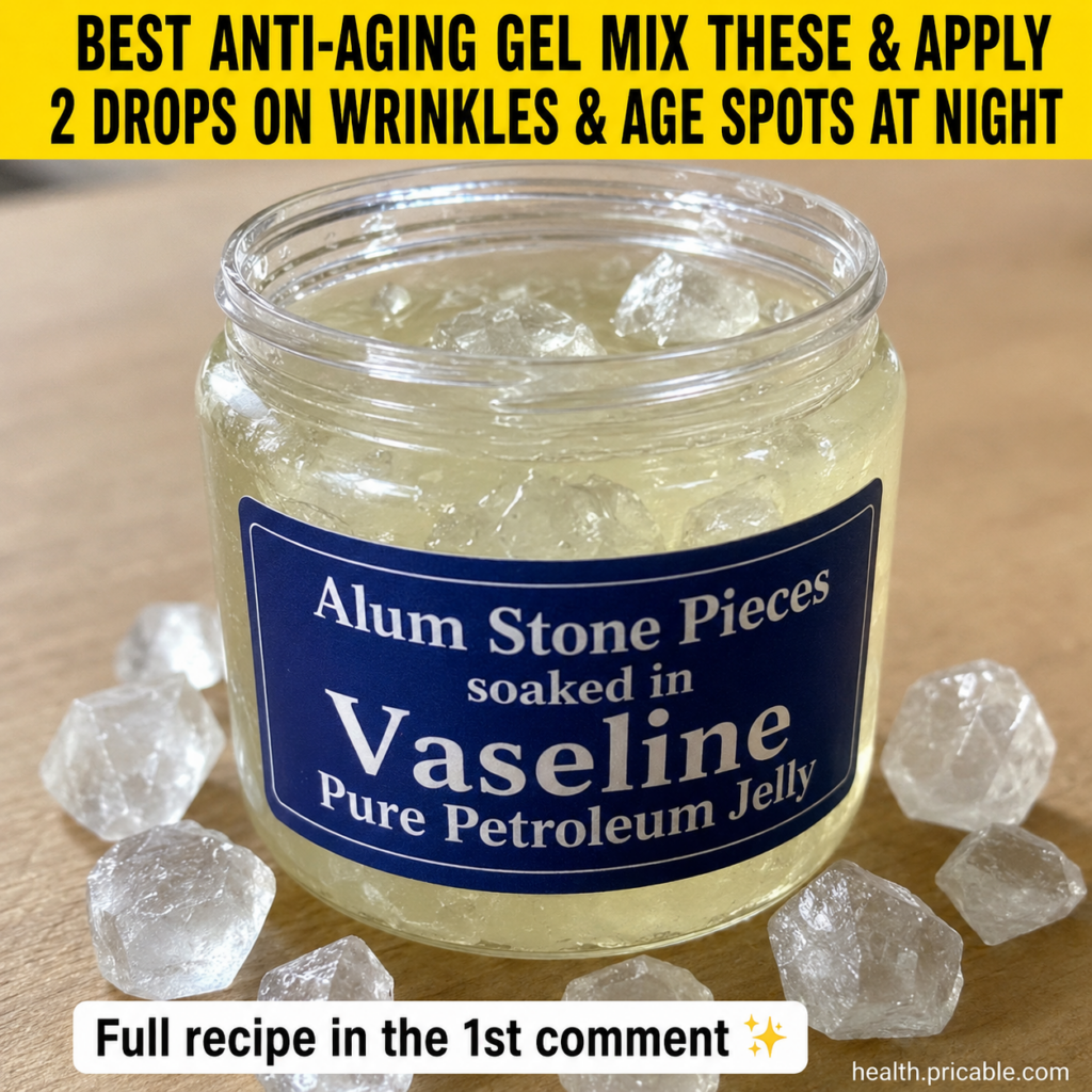 Close-up of a small block of alum stone next to an open jar of Vaseline petroleum jelly on a light background