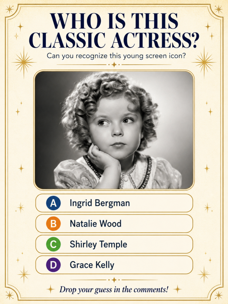A black and white photo of a very young Shirley Temple smiling and looking adorable with her signature curly hair